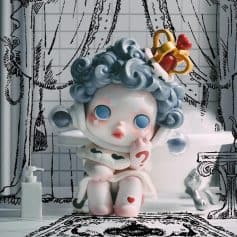 Adorable monalisa-themed doll with curly hair, blue eyes, and a thoughtful pose, set in a whimsical bathroom with artistic black-and-white doodle background for home decor or gift ideas.