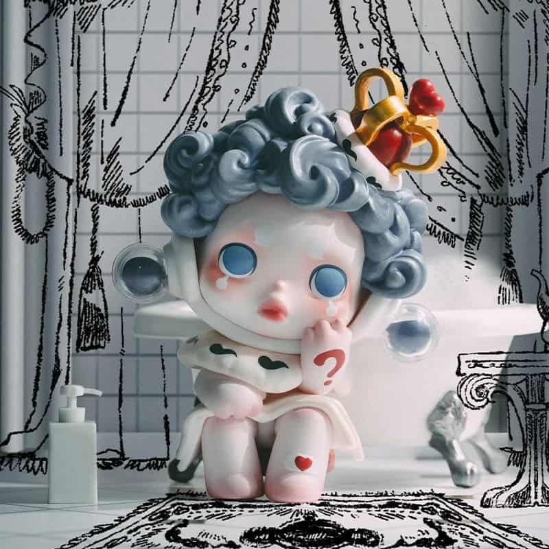 Adorable monalisa-themed doll with curly hair, blue eyes, and a thoughtful pose, set in a whimsical bathroom with artistic black-and-white doodle background for home decor or gift ideas.