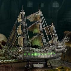 Detailed silver pirate ship with illuminated green lights, perfect for collectors and maritime enthusiasts.