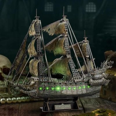Detailed silver pirate ship with illuminated green lights, perfect for collectors and maritime enthusiasts.