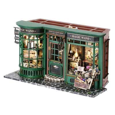Detailed close-up of a whimsical toy store model featuring intricate design, colorful decor, and miniature wizarding accessories perfect for magic and fantasy enthusiasts.