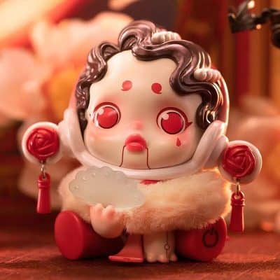 Adorable Chinese-style doll figurine with red accessories, delicate facial features, and detailed hair, perfect for home decor or collector's display.