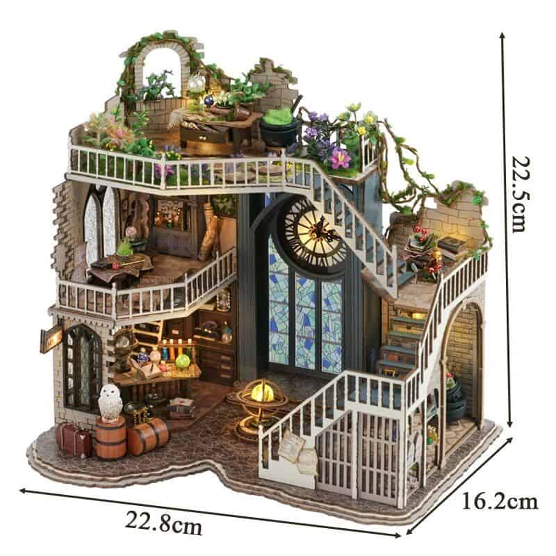 Detailed miniature model of a fantasy house with multiple floors, stairs, and decorative elements. Perfect for collectors and dollhouse enthusiasts seeking a unique display piece.