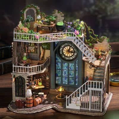 Detailed miniature dollhouse with clock tower, featuring stairs, books, and greenery, perfect for collector’s decor and opt enthusiasts seeking unique home accents.