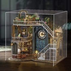 Detailed miniature dollhouse with multi-level design, garden elements, and vintage furnishings, perfect for collectors and enthusiasts interested in luxury and unique home decor models.