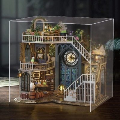 Detailed miniature dollhouse with multi-level design, garden elements, and vintage furnishings, perfect for collectors and enthusiasts interested in luxury and unique home decor models.