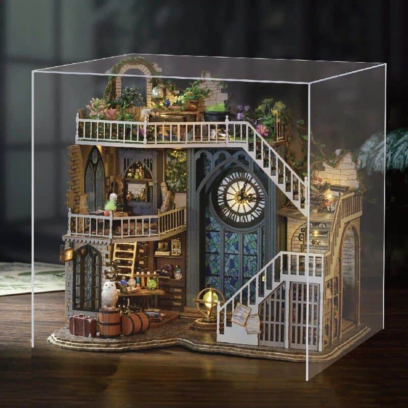 Detailed miniature dollhouse with multi-level design, garden elements, and vintage furnishings, perfect for collectors and enthusiasts interested in luxury and unique home decor models.