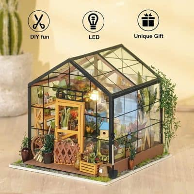 Glass greenhouse with LED lighting, perfect for indoor plant display and gardening enthusiasts. Innovative gift idea for plant lovers.