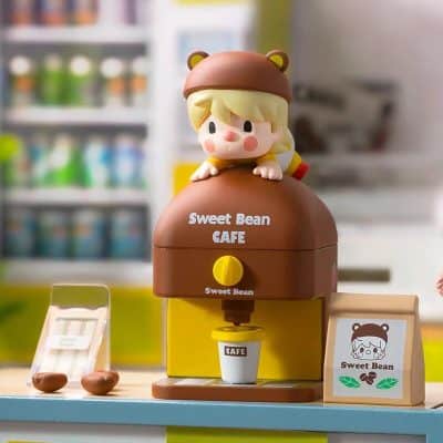 Cute cartoon girl toy on coffee machine, kid-friendly design, ideal for children’s play and educational purposes at Monalisa Store.