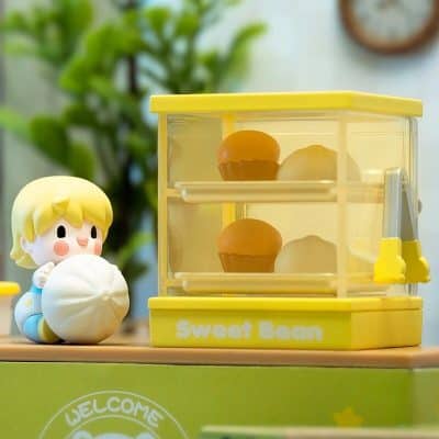 Bright yellow toy storage box for sweet bean and dessert toys, featuring a cute