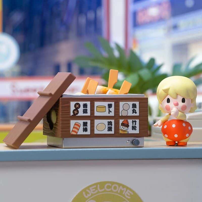 Colorful toy sushi and vegetables with Japanese labels, perfect for educational play and learning about Japanese cuisine.