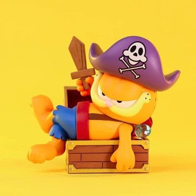 Adorable pirate cat toy with skeleton hat, treasure chest, and sword, perfect for kids and collectors. Bright, playful design inspired by pirate adventures.