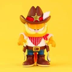 Playful cowboy cat toy with sheriff hat, red bandana, and boots, perfect for kids’ room decor and as a fun collectible. Bright yellow background highlights its adorable, whimsical design.