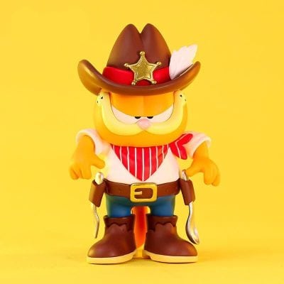 Playful cowboy cat toy with sheriff hat, red bandana, and boots, perfect for kids’ room decor and as a fun collectible. Bright yellow background highlights its adorable, whimsical design.