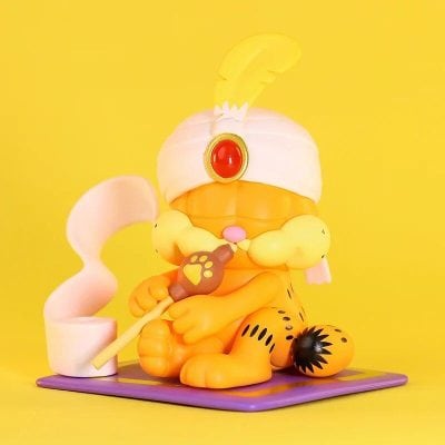 Colorful clown figure with king crown, holding a scepter, on vibrant yellow background for children's toy collection or festive decoration.
