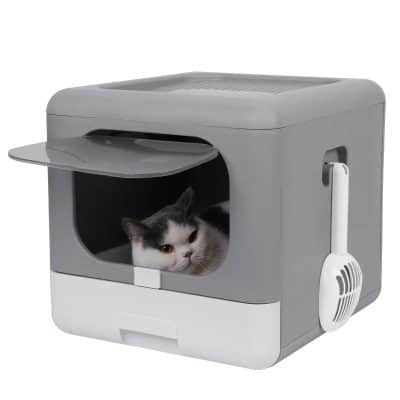 An automatic pet litter box with a cat lounging inside, designed for easy cleaning and odor control, ideal for cat owners seeking hygienic pet care solutions.