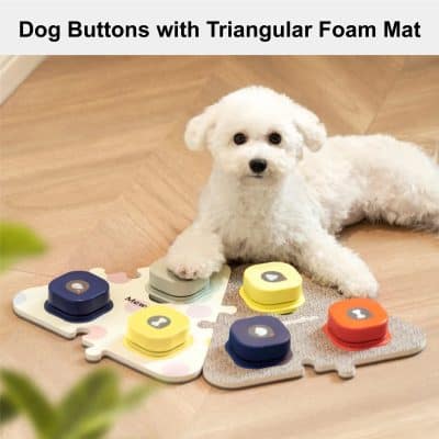 Cute white puppy lying on a wooden floor next to colorful dog activity buttons on a foam puzzle mat, designed for pet mental stimulation and training.