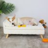 Dog resting on soft pet bed with toys, highlighting pet comfort and accessories available at Monalisa Store for pet lovers.