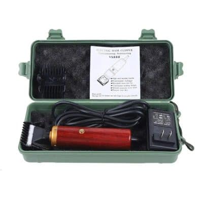 Portable electric hair clipper with power adapter and accessories, ideal for professional and home use.