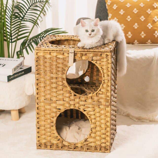 Luxurious cat tower with multiple levels and cozy hideouts, perfect for cats to play, climb, and relax. Made of durable, stylish wicker for a modern look that complements home decor.
