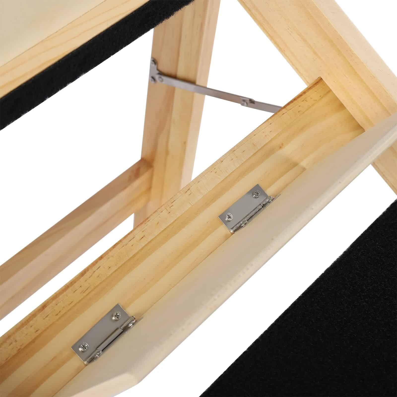 Close-up of a wooden optometry display frame with metal hinges, designed to hold glasses securely at Monalisa Medical.