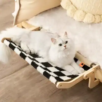Luxurious white cat lying comfortably on a black-and-white cozy pet hammock, perfect for cat rest and relaxation, available at Monalisa Store.