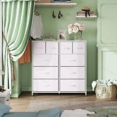 A modern white dresser with 12 drawers in a cozy bedroom, perfect for clothing and accessories, highlighted by soft pastel green walls and decorative accents.