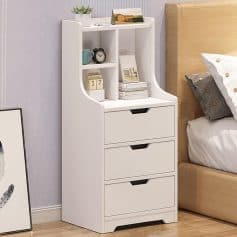 A sleek white bedside chest with multiple drawers and open shelves, perfect for bedroom storage and convenience. Features a minimalist design suitable for stylish, functional bedroom decor.