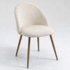 Comfortable modern dining chair with sleek white upholstery and wooden legs for stylish interior decor and dining spaces.