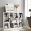 Stylish white bookshelf featuring decorative items, books, and modern accents in a bright, cozy home office or living room environment.