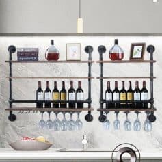 Decorative wine and glass rack display for kitchen or bar area, featuring black metal pipe frame with wooden shelves for bottles and wine glasses, perfect for modern home or restaurant decor.