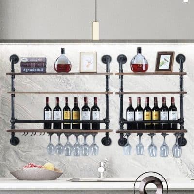 Decorative wine and glass rack display for kitchen or bar area, featuring black metal pipe frame with wooden shelves for bottles and wine glasses, perfect for modern home or restaurant decor.