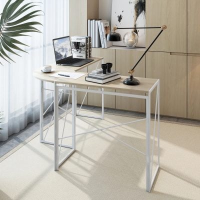 Light-colored wooden desk with minimalist design placed in a bright room, featuring a sleek laptop, books, and decorative items perfect for optical professionals or reading enthusiasts.
