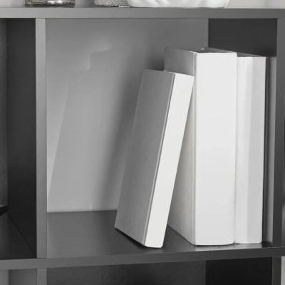 Empty white books on modern gray display shelf, ideal for optometry clinic, eyewear shop, or optical store decor.