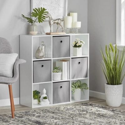 Stylish white storage cube with decorative accents and plants, perfect for living rooms or offices, combining functionality with elegant design for opt space.
