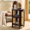 Stylish round wooden nightstand with rattan accents, suitable for living rooms or bedrooms, featuring drawers, decorative accessories, and contemporary design for home decor.