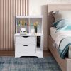 Bright white bedroom side table with drawers, decorative flower vase, tissue holder, and modern accents, perfect for enhancing bedroom decor and storage.