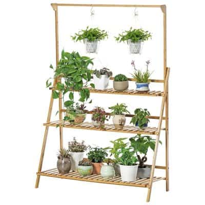 Decorative wooden plant shelf for indoor gardening and home decor.