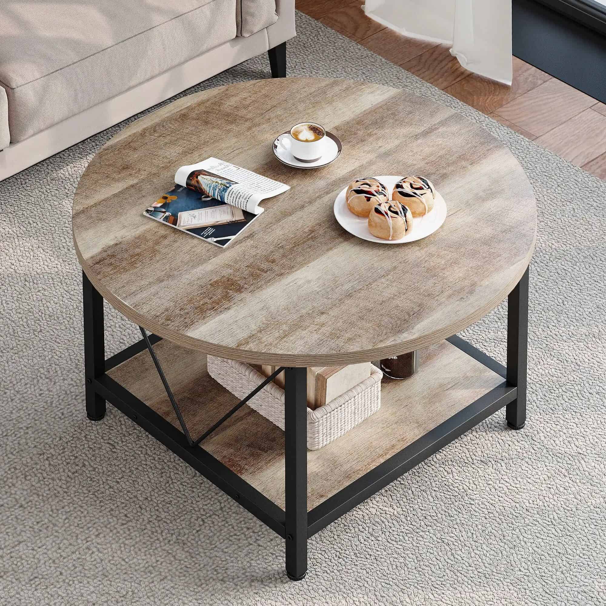 A stylish round wooden coffee table in a modern living room setting, decorated with magazines, coffee, and sweet treats for a comfortable and elegant atmosphere.