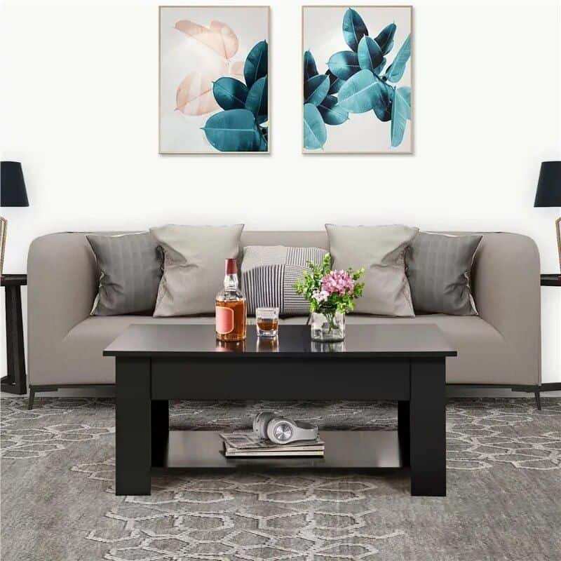 Contemporary living room with comfortable sofa, decorative cushions, floral centerpiece, and modern art wall decor, showcasing stylish interior design and home decor ideas.