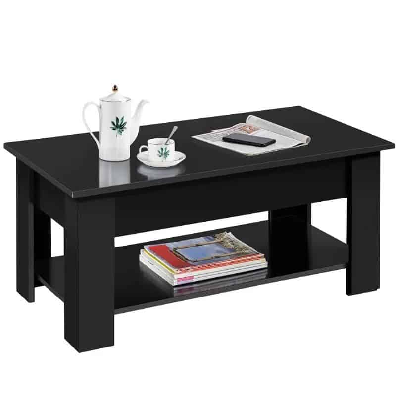 Stylish black coffee table with magazines and tea set on top, perfect for living room decor. Durable wood design enhances modern aesthetics and provides functional storage space underneath.