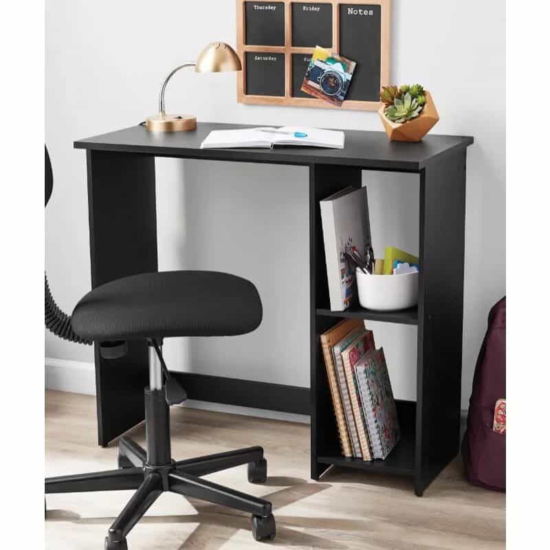 A sleek black desk ideal for optometry offices or study spaces, featuring a lamp, books, notebooks, and organized shelves for eyewear or supplies. Perfect for professional or personal use.