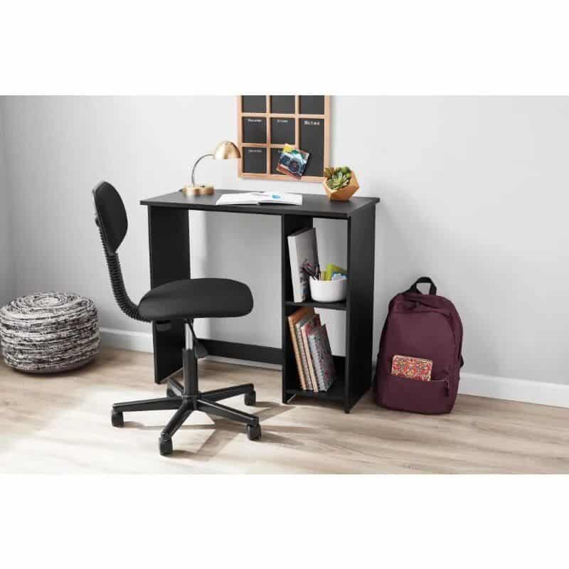 A sleek black office desk with a comfortable ergonomic chair, perfect for optical clinics or optometry offices. Features storage shelves, a desktop organizer, and a stylish decor accent, ideal for professional eyewear shops.