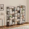A sleek black and wood bookshelf filled with books, decorative items, and plants adds contemporary elegance to the living room or office space.