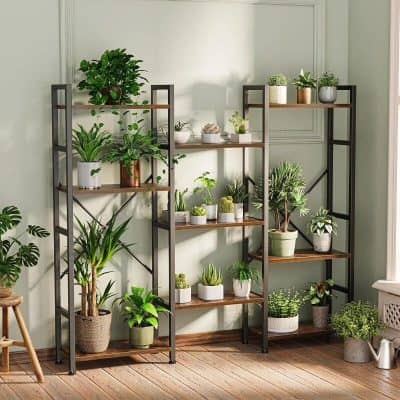 A stylish multilevel plant stand showcasing various indoor plants in modern pots, ideal for enhancing home decor with greenery and creating a fresh, natural ambiance.