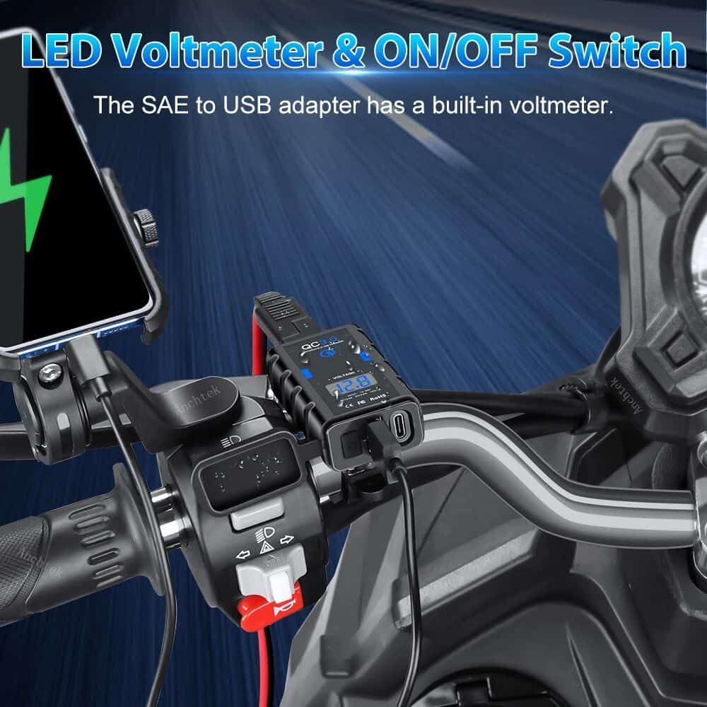 Alt text: Close-up of a motorcycle handlebars with a built-in LED voltmeter and USB adapter, highlighting the easy-to-read display and charging capabilities for electric scooter and bike maintenance.