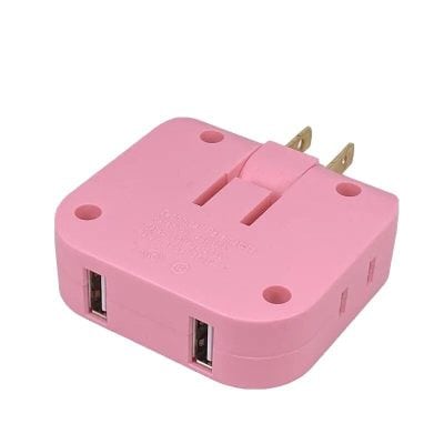 Compact pink USB power adapter with dual ports, perfect for charging multiple devices efficiently at home or travel. Compatible with various electronic gadgets for convenience and fast charging.