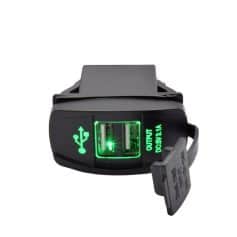 Compact portable charging port with dual USB output for devices. Features green LED indicators for easy use. Ideal for on-the-go power needs, ensuring your electronic devices stay charged anytime.