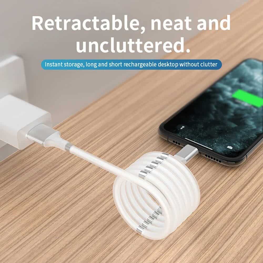 A neat, retractable desktop organizer designed for keeping electronic accessories tidy, perfect for use with smartphones, chargers, and cables, ensuring clutter-free workspace.