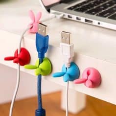 Cute silicone cable clips for organizing USB cables and chargers.